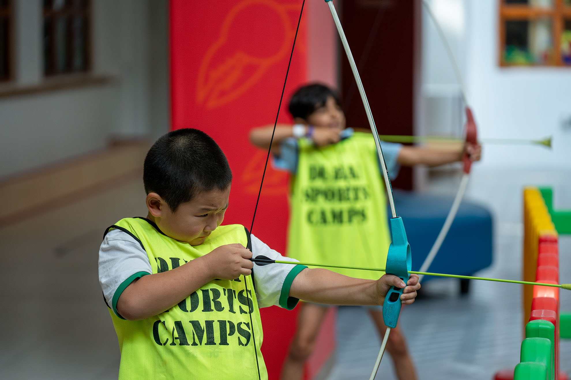 Kids developing concentration and precision through archery practice