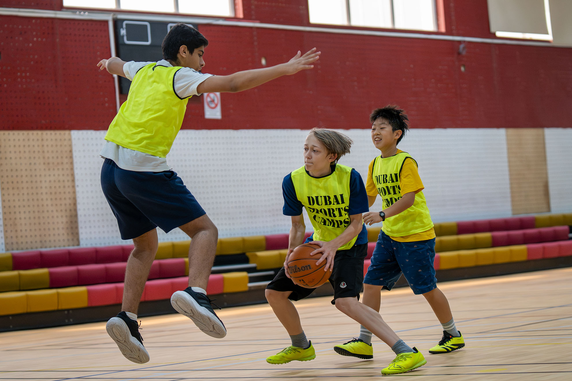 Kids learning basketball fundamentals and enjoying court games