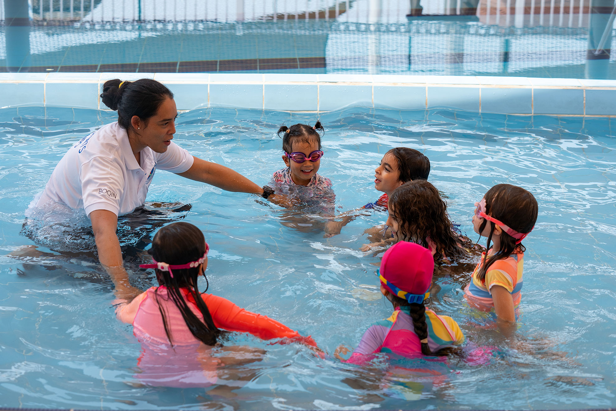 Kids enjoying swimming activities and learning essential water skills